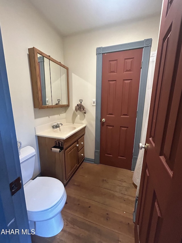 217 Good Shepherd Rd, Altoona, PA 16601 - half bath featuring toilet, vanity, and wood finished floors