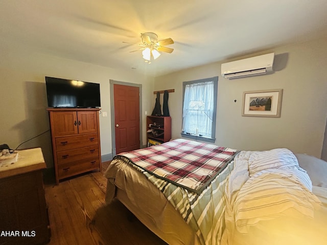 217 Good Shepherd Rd, Altoona, PA 16601 - bedroom with a wall mounted AC, ceiling fan, and dark wood-style flooring