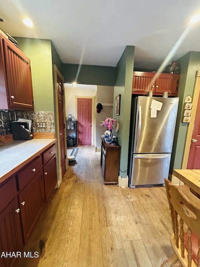 217 Good Shepherd Rd, Altoona, PA 16601 - kitchen with recessed lighting, light countertops, backsplash, freestanding refrigerator, and light wood-style flooring