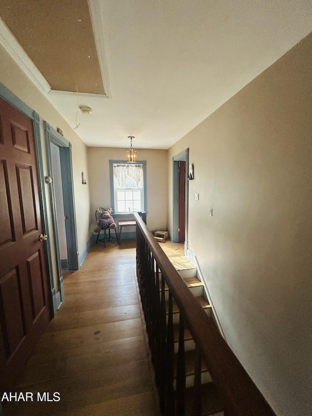 217 Good Shepherd Rd, Altoona, PA 16601 - hall with attic access, an inviting chandelier, hardwood / wood-style floors, and baseboards