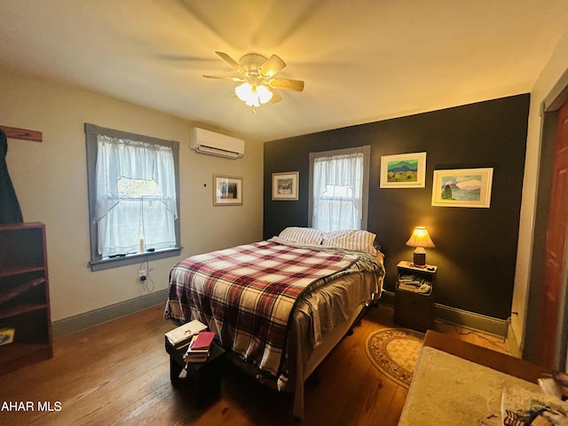 217 Good Shepherd Rd, Altoona, PA 16601 - bedroom with hardwood / wood-style flooring, an AC wall unit, multiple windows, and ceiling fan