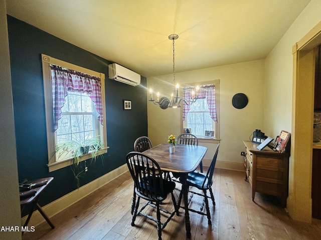 217 Good Shepherd Rd, Altoona, PA 16601 - dining room with a chandelier, a wall mounted air conditioner, hardwood / wood-style floors, and baseboards