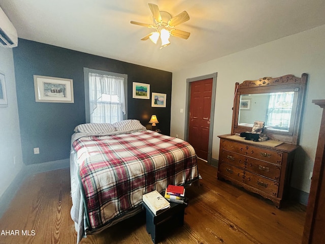 217 Good Shepherd Rd, Altoona, PA 16601 - bedroom featuring an AC wall unit, baseboards, a ceiling fan, and wood finished floors