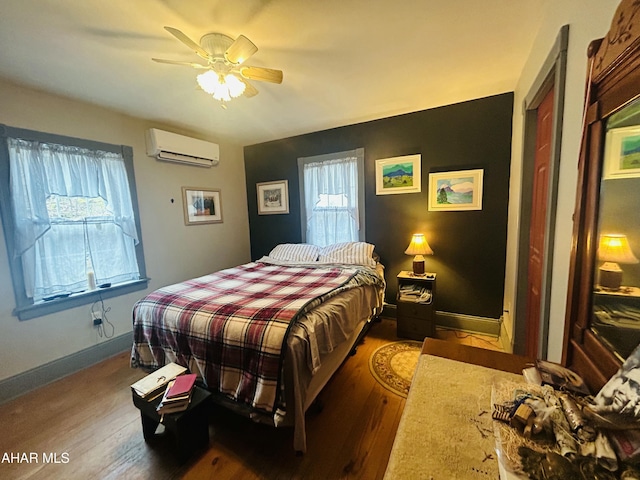 217 Good Shepherd Rd, Altoona, PA 16601 - bedroom featuring baseboards, wood finished floors, an AC wall unit, and ceiling fan