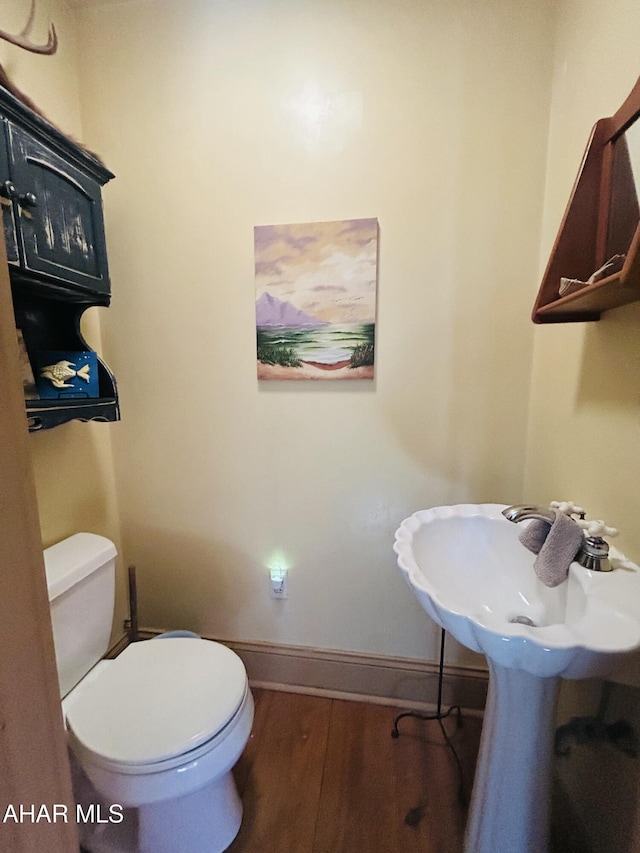 217 Good Shepherd Rd, Altoona, PA 16601 - bathroom with wood finished floors, toilet, and baseboards