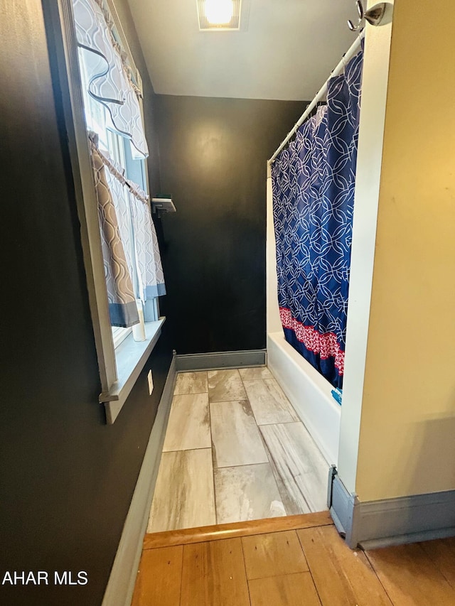 217 Good Shepherd Rd, Altoona, PA 16601 - full bath with shower / bath combo, wood finished floors, and visible vents