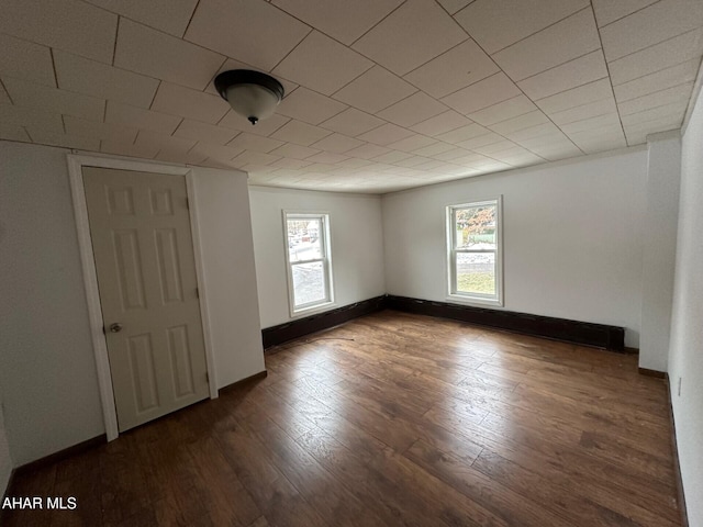 spare room featuring dark hardwood / wood-style floors