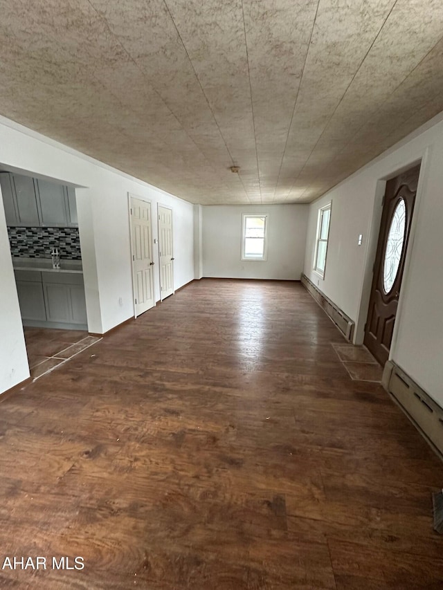 interior space featuring dark hardwood / wood-style flooring and a baseboard radiator