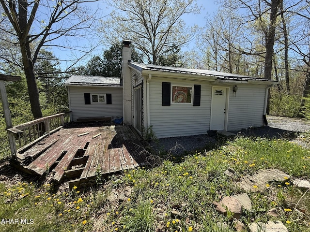 229 Celtic Ln, Altoona, PA 16601 - back of house featuring a wooden deck, a chimney, and metal roof
