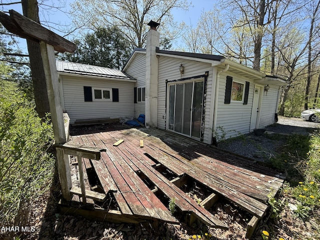 229 Celtic Ln, Altoona, PA 16601 - rear view of house with a chimney, a deck, and metal roof