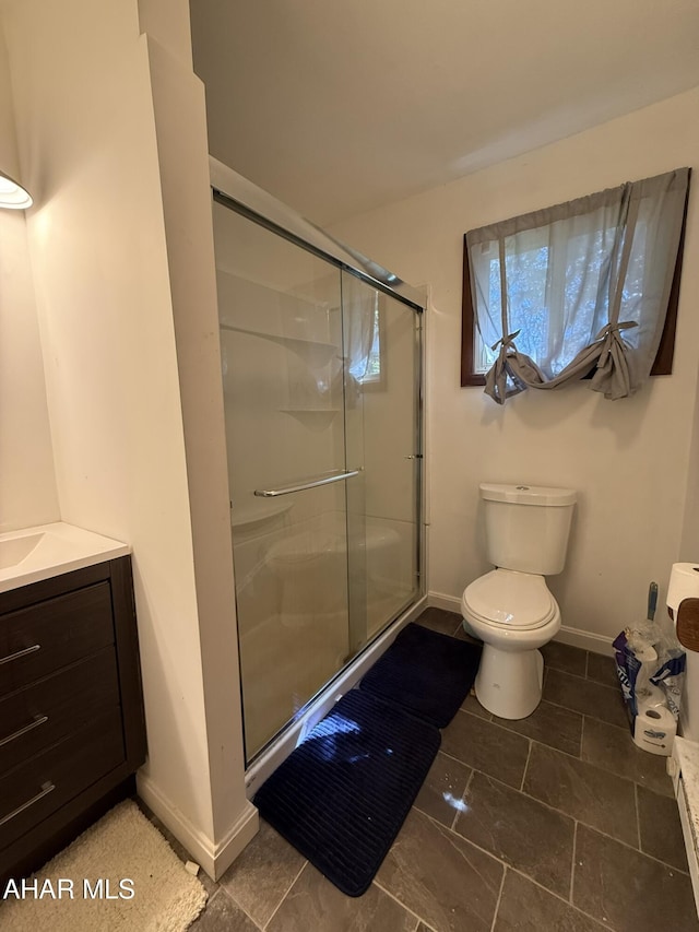 229 Celtic Ln, Altoona, PA 16601 - bathroom with baseboards, vanity, toilet, and a shower stall