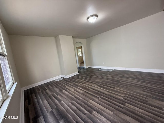 316 3rd Ave, Altoona, PA 16602 - unfurnished room with arched walkways and dark wood-style floors