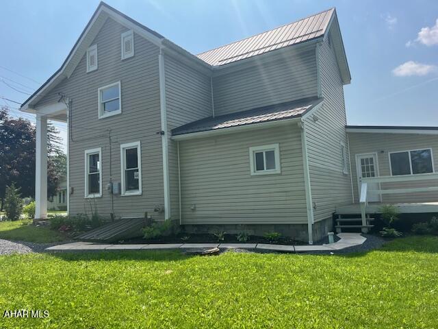 208 W 5th Ave, Everett, PA 15537 - back of house featuring a lawn, a metal roof, and a wooden deck