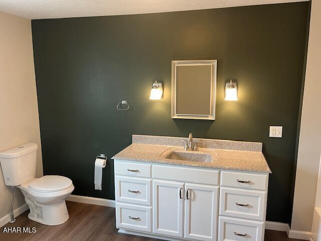 208 W 5th Ave, Everett, PA 15537 - bathroom featuring vanity and wood finished floors