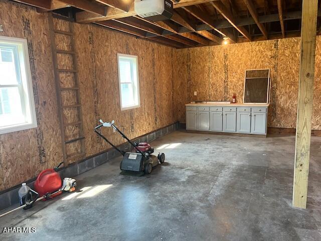 208 W 5th Ave, Everett, PA 15537 - miscellaneous room with unfinished concrete floors and a garage