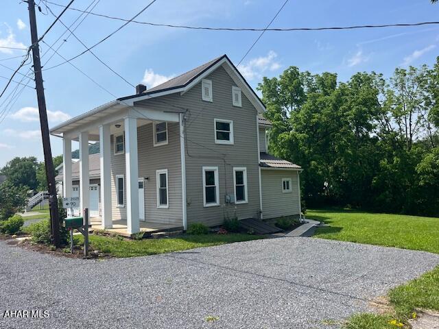 208 W 5th Ave, Everett, PA 15537 - view of front of property with a front yard and covered porch