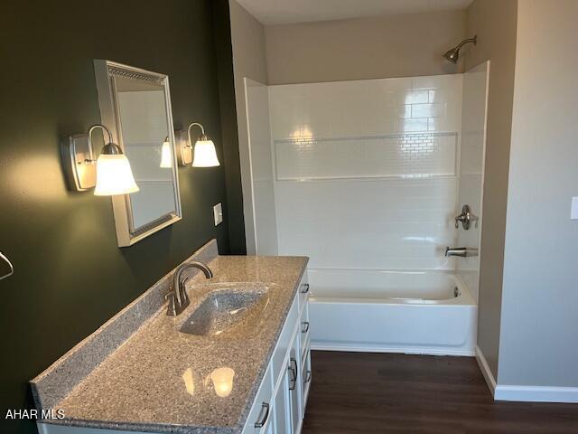 208 W 5th Ave, Everett, PA 15537 - full bath featuring wood finished floors, vanity, and bathing tub / shower combination