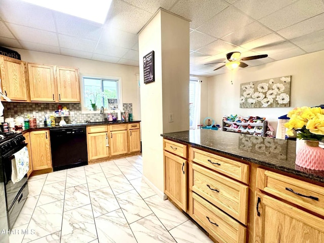311 E Bell Ave, Altoona, PA 16602 - kitchen with black appliances, a drop ceiling, light marble finish floors, ceiling fan, and dark stone countertops