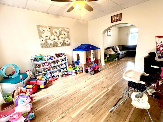311 E Bell Ave, Altoona, PA 16602 - rec room featuring arched walkways, a drop ceiling, wood finished floors, and a ceiling fan