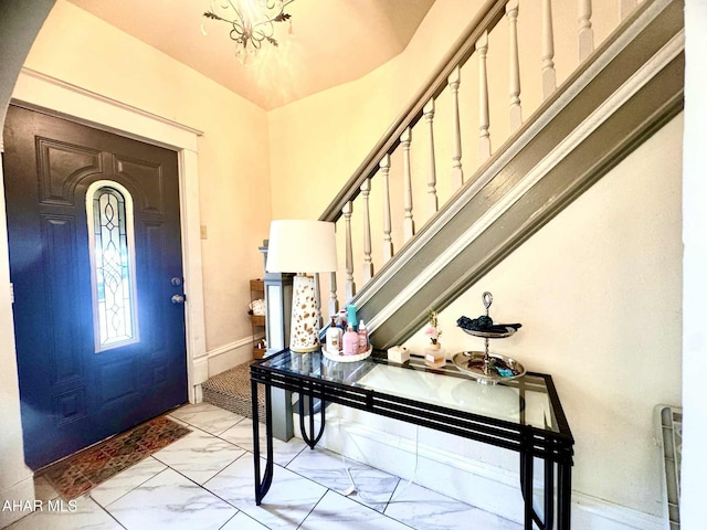 311 E Bell Ave, Altoona, PA 16602 - entryway featuring light marble finish flooring, a chandelier, and stairway