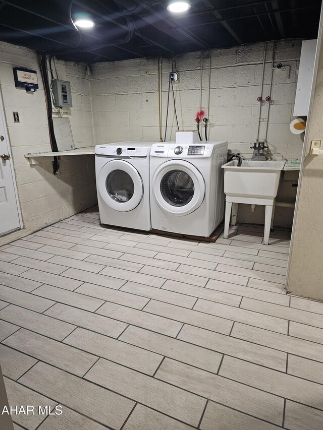2204 17th Ave, Altoona, PA 16601 - clothes washing area featuring electric panel, washing machine and clothes dryer, and laundry area