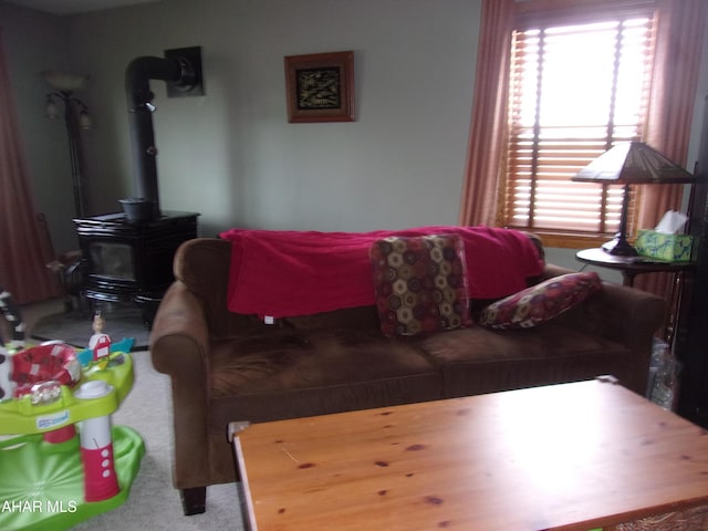 3752 Main Rd, Bedford, PA 15522 - carpeted living area with plenty of natural light and a wood stove