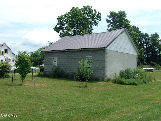 3752 Main Rd, Bedford, PA 15522 - view of property exterior featuring a yard and a metal roof