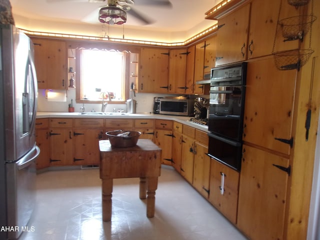 3752 Main Rd, Bedford, PA 15522 - kitchen featuring stainless steel appliances, a warming drawer, a ceiling fan, light flooring, and light countertops