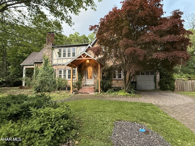 5 Log Cabin Ct, Altoona, PA 16602 - english style home featuring driveway, a chimney, a garage, and stone siding