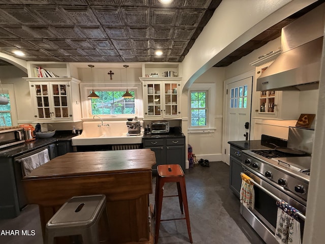 5 Log Cabin Ct, Altoona, PA 16602 - kitchen with stainless steel appliances, wall chimney range hood, an ornate ceiling, arched walkways, and a sink