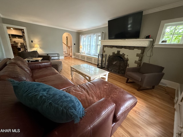 5 Log Cabin Ct, Altoona, PA 16602 - living room with a fireplace, arched walkways, ornamental molding, wood finished floors, and baseboards