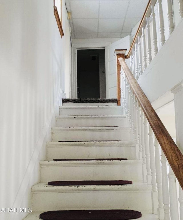 staircase with a drop ceiling