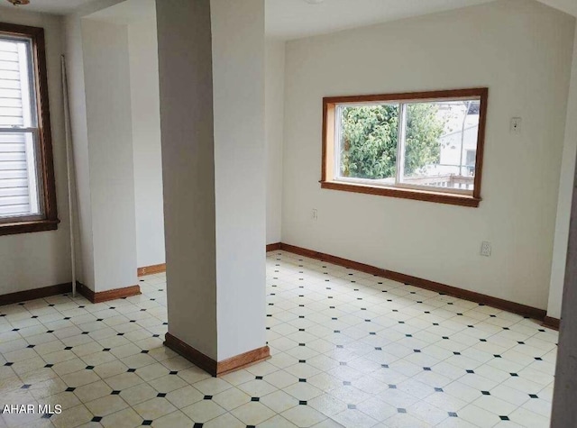 spare room featuring a wealth of natural light