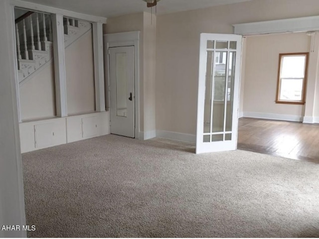 empty room with hardwood / wood-style floors