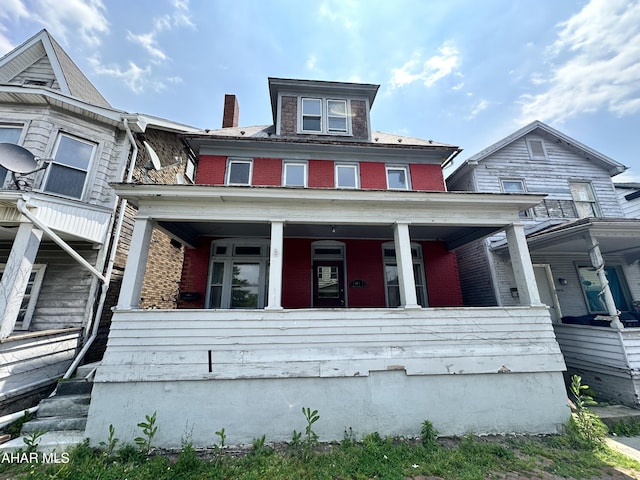 2013 7th Ave, Altoona, PA 16602 - view of front facade featuring covered porch and brick siding