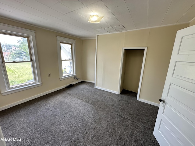 2013 7th Ave, Altoona, PA 16602 - unfurnished bedroom with dark colored carpet and baseboards