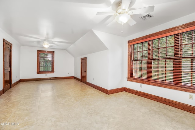 bonus room featuring ceiling fan, lofted ceiling, and light tile patterned floors