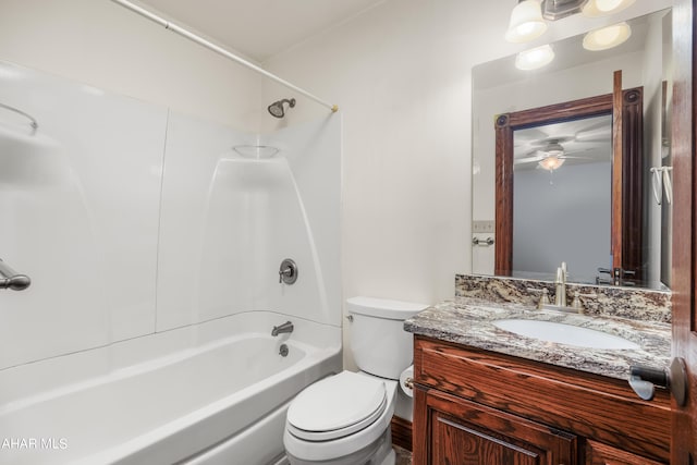 full bathroom featuring vanity, ceiling fan, toilet, and shower / tub combination