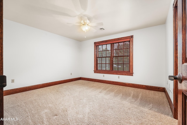 carpeted empty room with ceiling fan