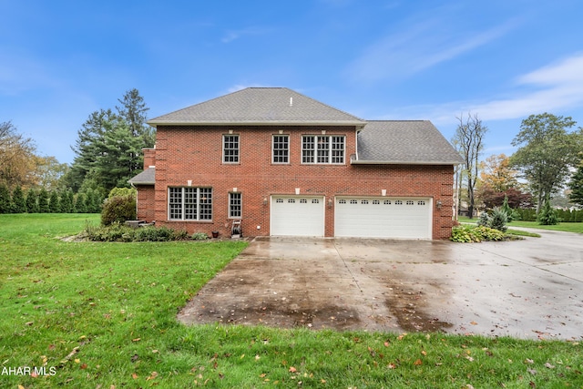 exterior space featuring a garage and a front lawn