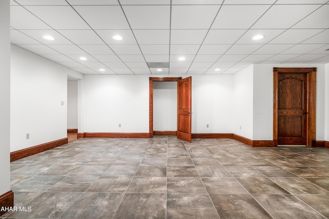 spare room featuring a drop ceiling