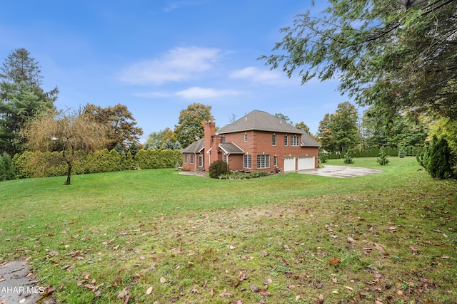 view of yard featuring a garage