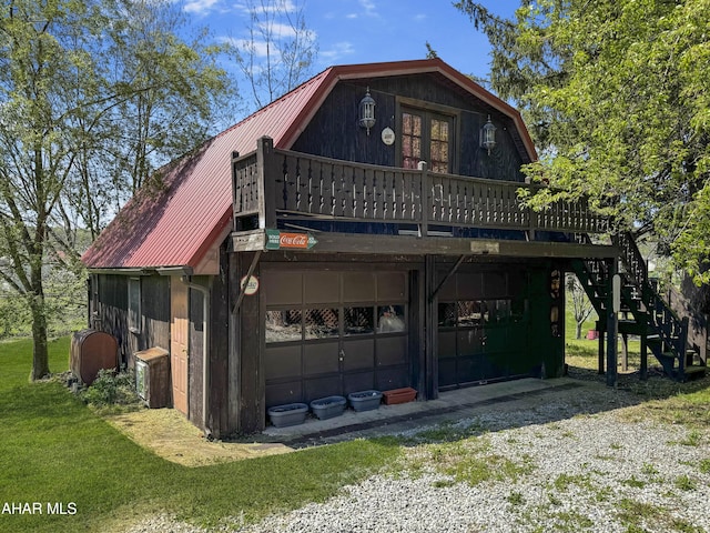 view of front of property with a front yard and a wooden deck