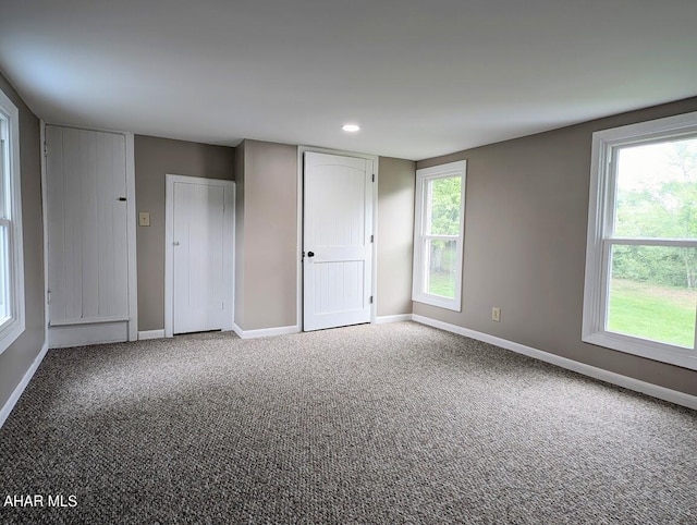 unfurnished room with carpet flooring