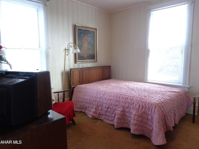 carpeted bedroom featuring ornamental molding