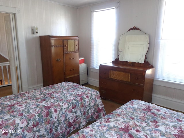 bedroom featuring multiple windows