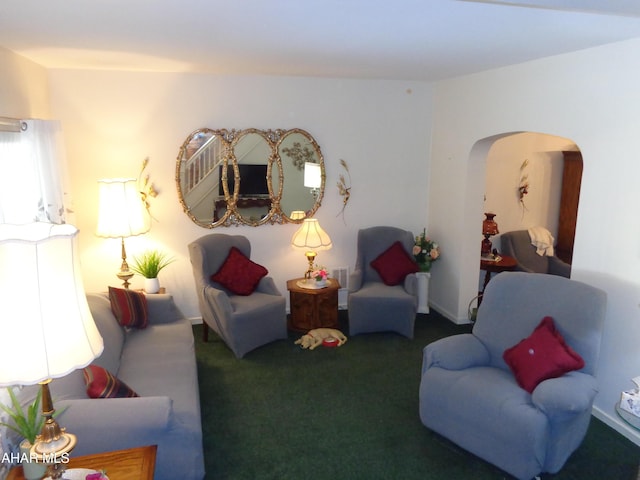 living area featuring dark colored carpet