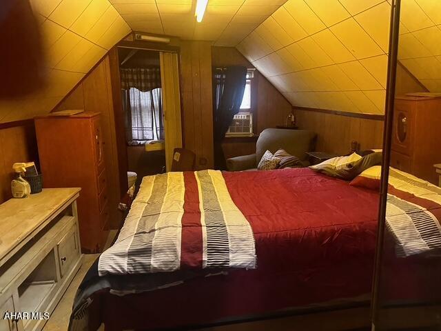 600 N 6th Ave, Altoona, PA 16601 - bedroom with wood walls, lofted ceiling, and cooling unit