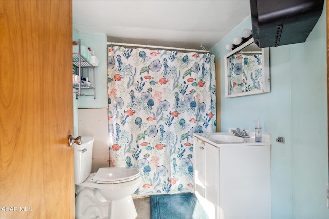 bathroom featuring vanity and toilet