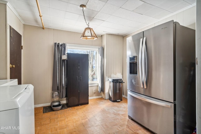 kitchen featuring decorative light fixtures, stainless steel fridge with ice dispenser, and light parquet floors